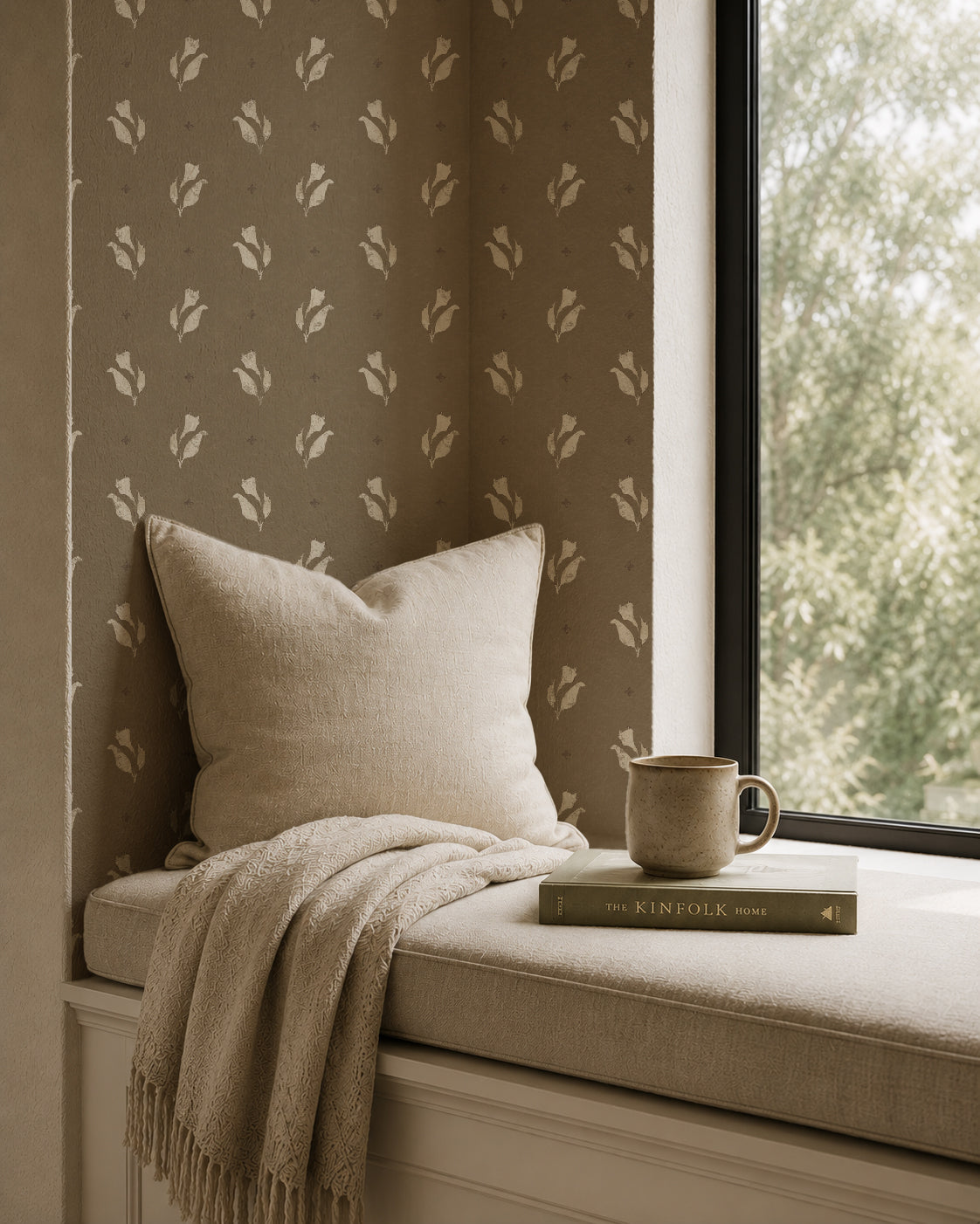 Olive floral wallpaper in cozy nook with beige pillow and blanket