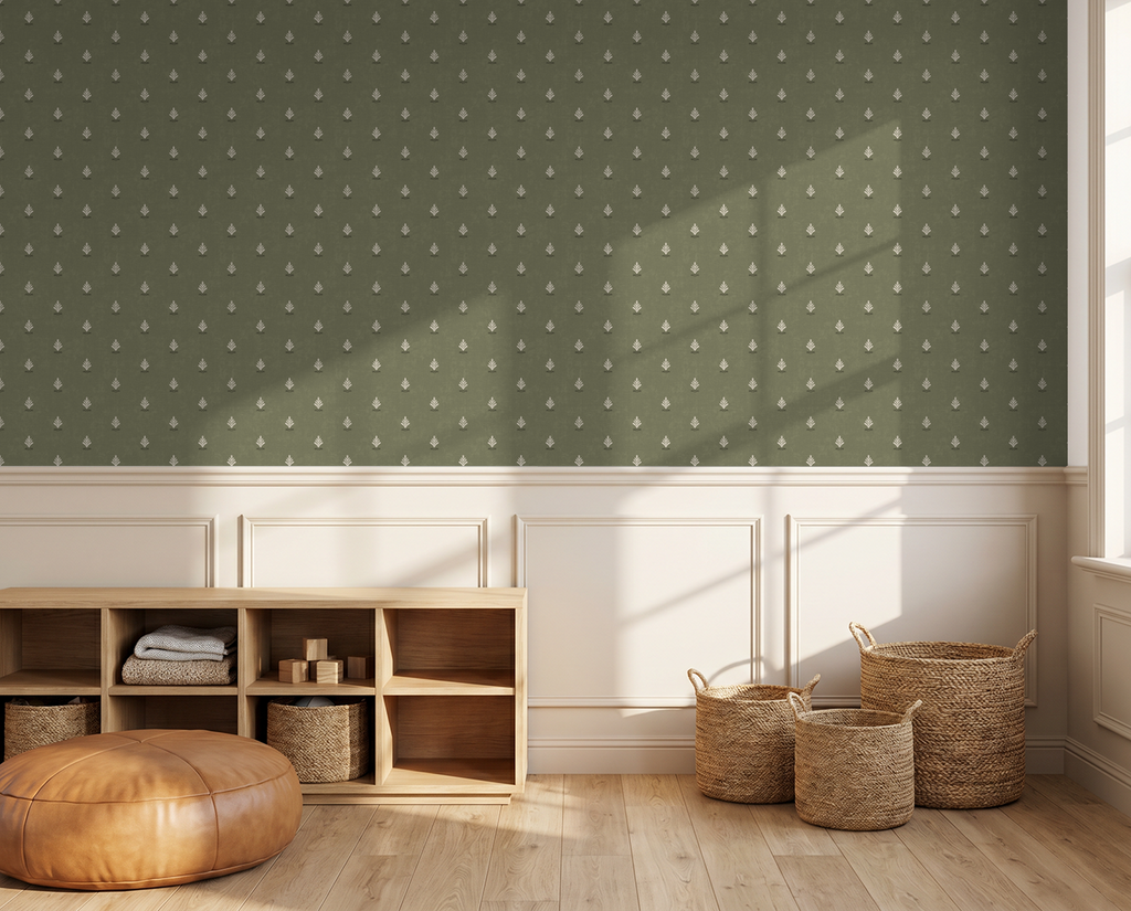 Olive green wallpaper with cream motifs in a sunlit room with wicker baskets.