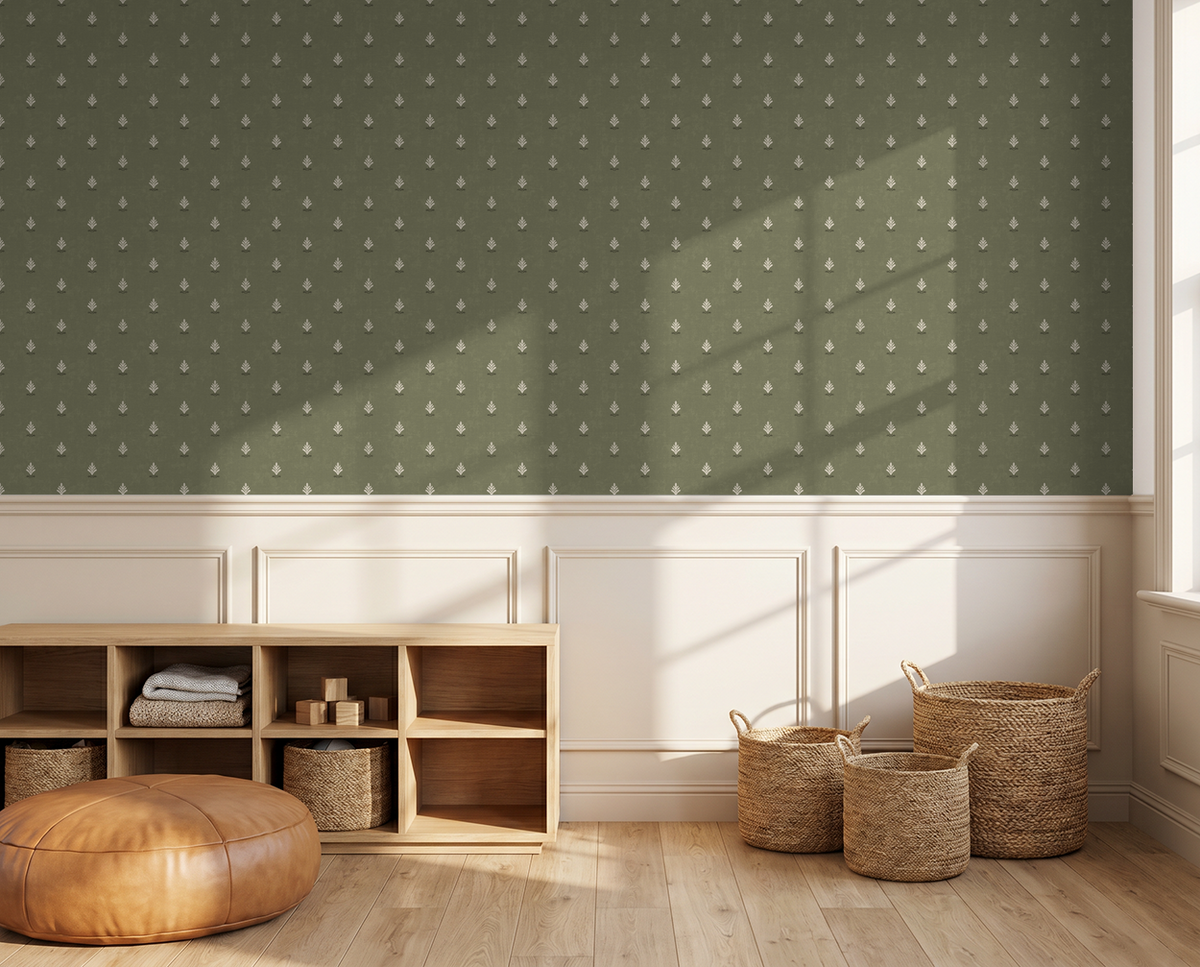 Olive green wallpaper with cream motifs in a sunlit room with wicker baskets.
