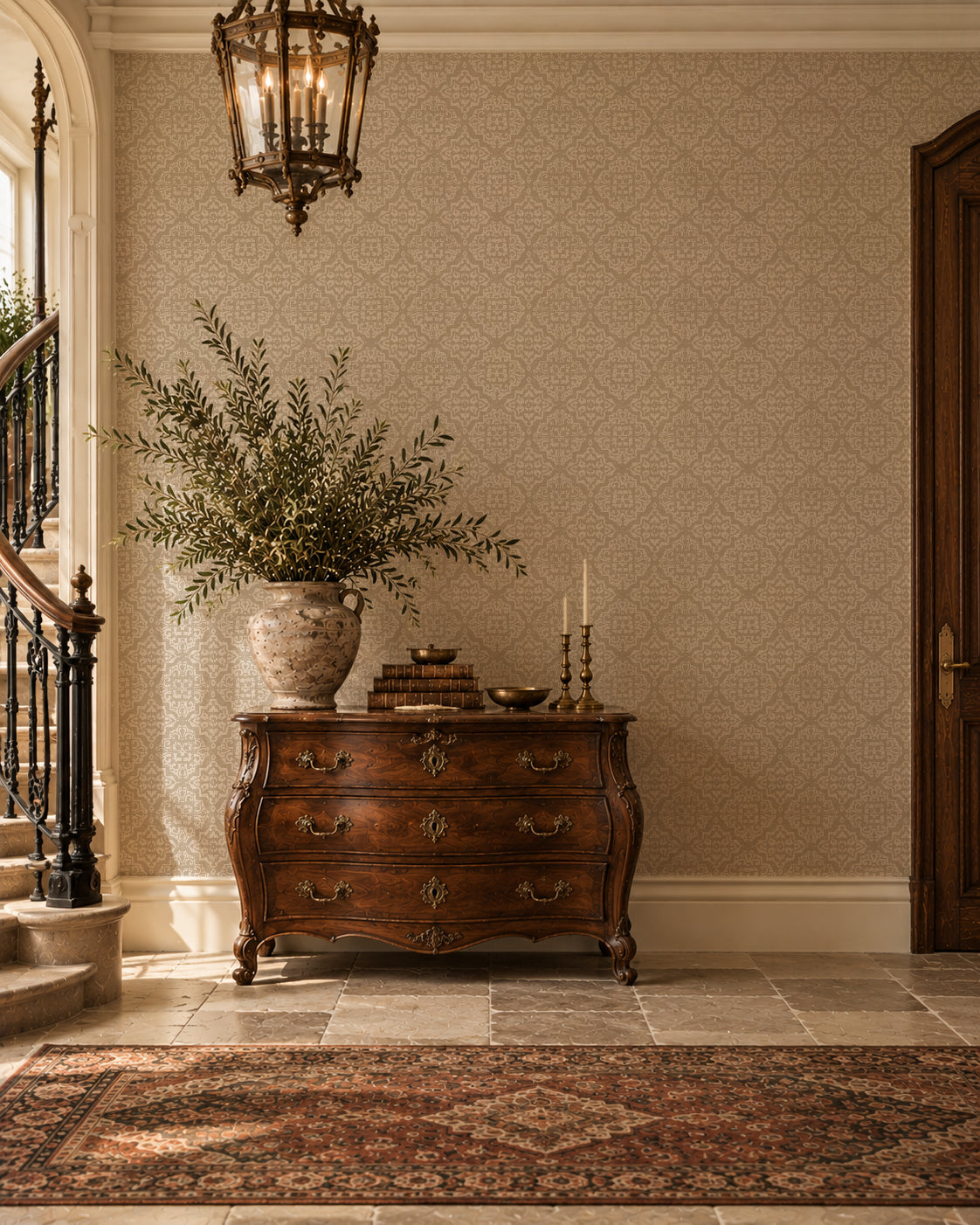 Ornamental taupe and cream damask wallpaper in elegant entryway with antique furniture.