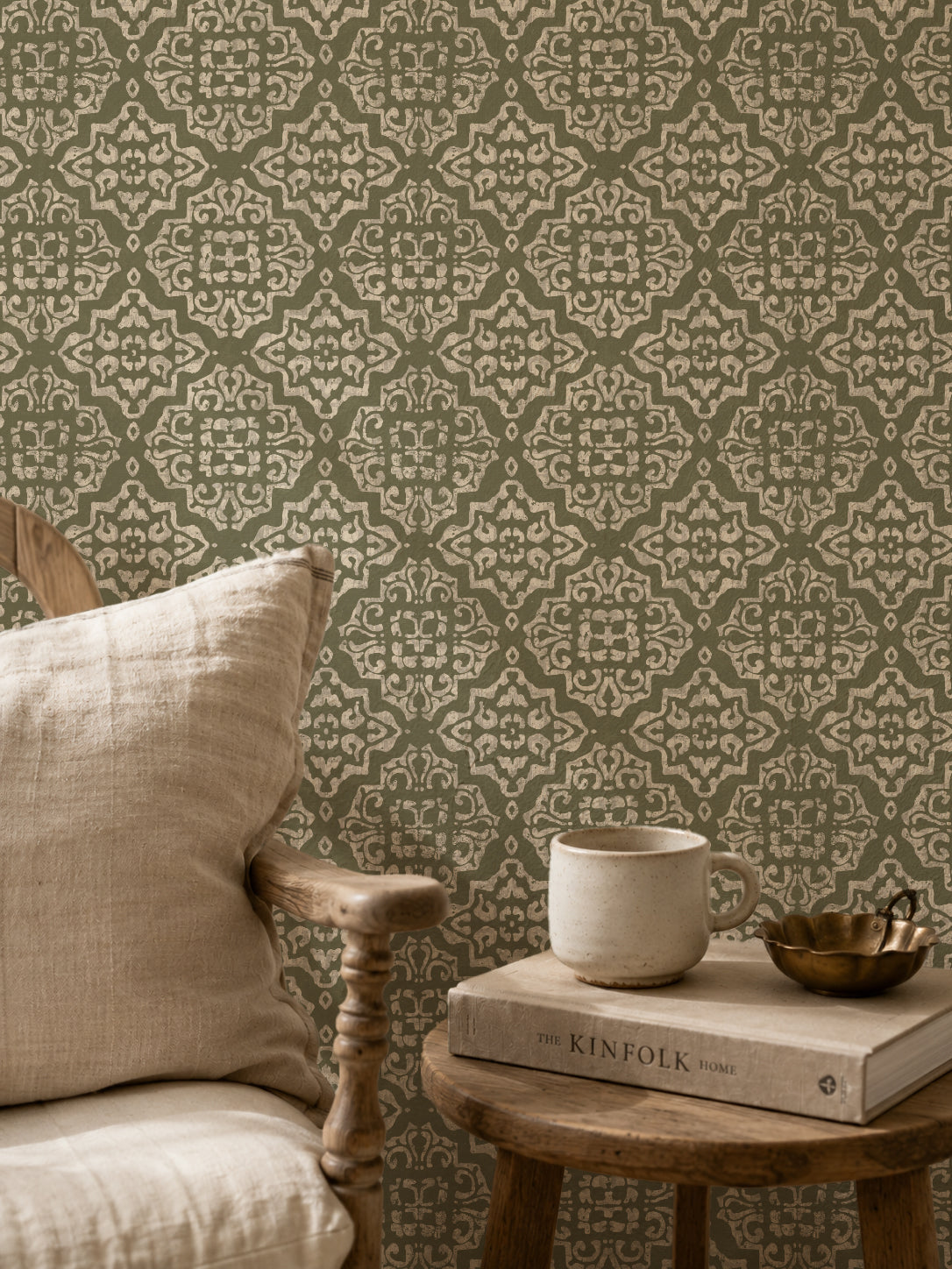 Ornate damask wallpaper in sage and cream with rustic decor setting.