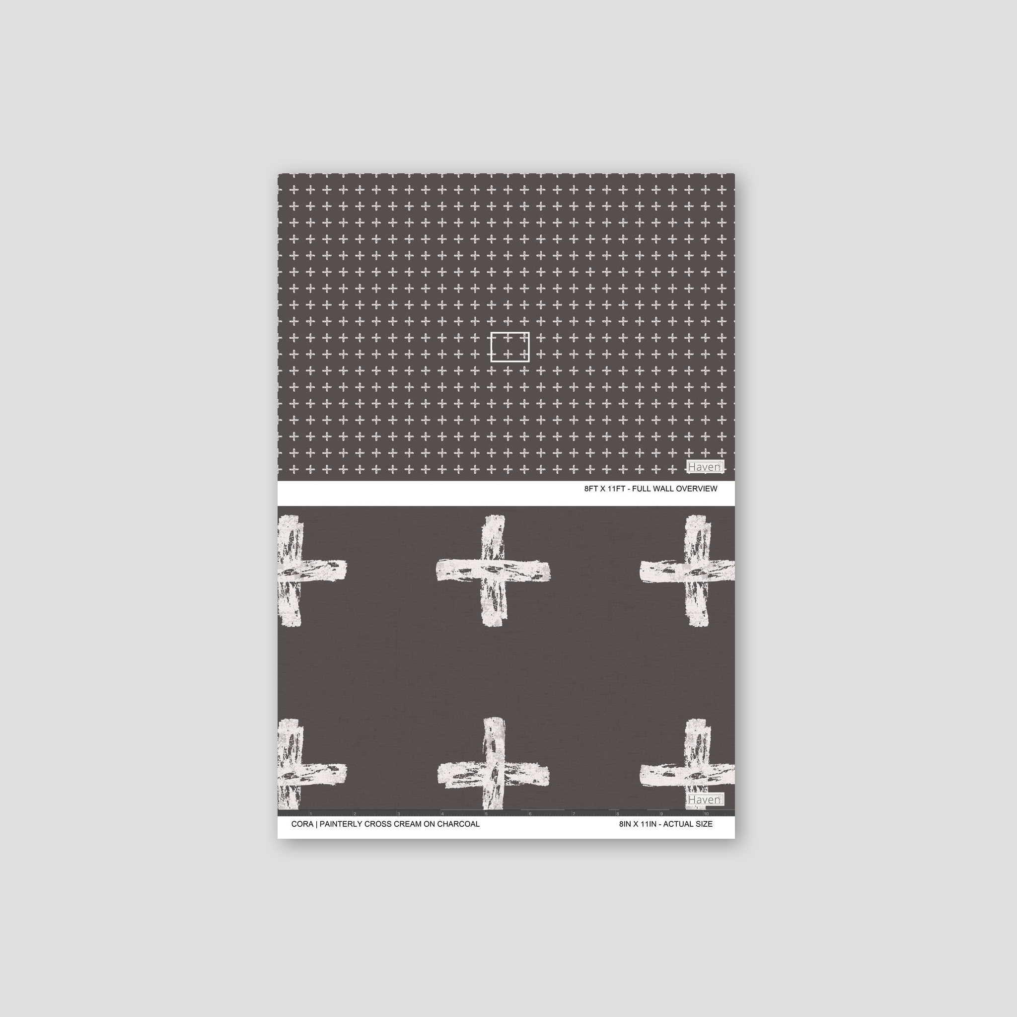 Painterly cross cream on charcoal wallpaper with bold geometric pattern.