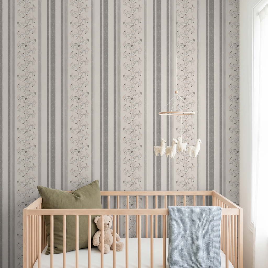 Pink slate floral stripe wallpaper in nursery with crib and teddy bear.