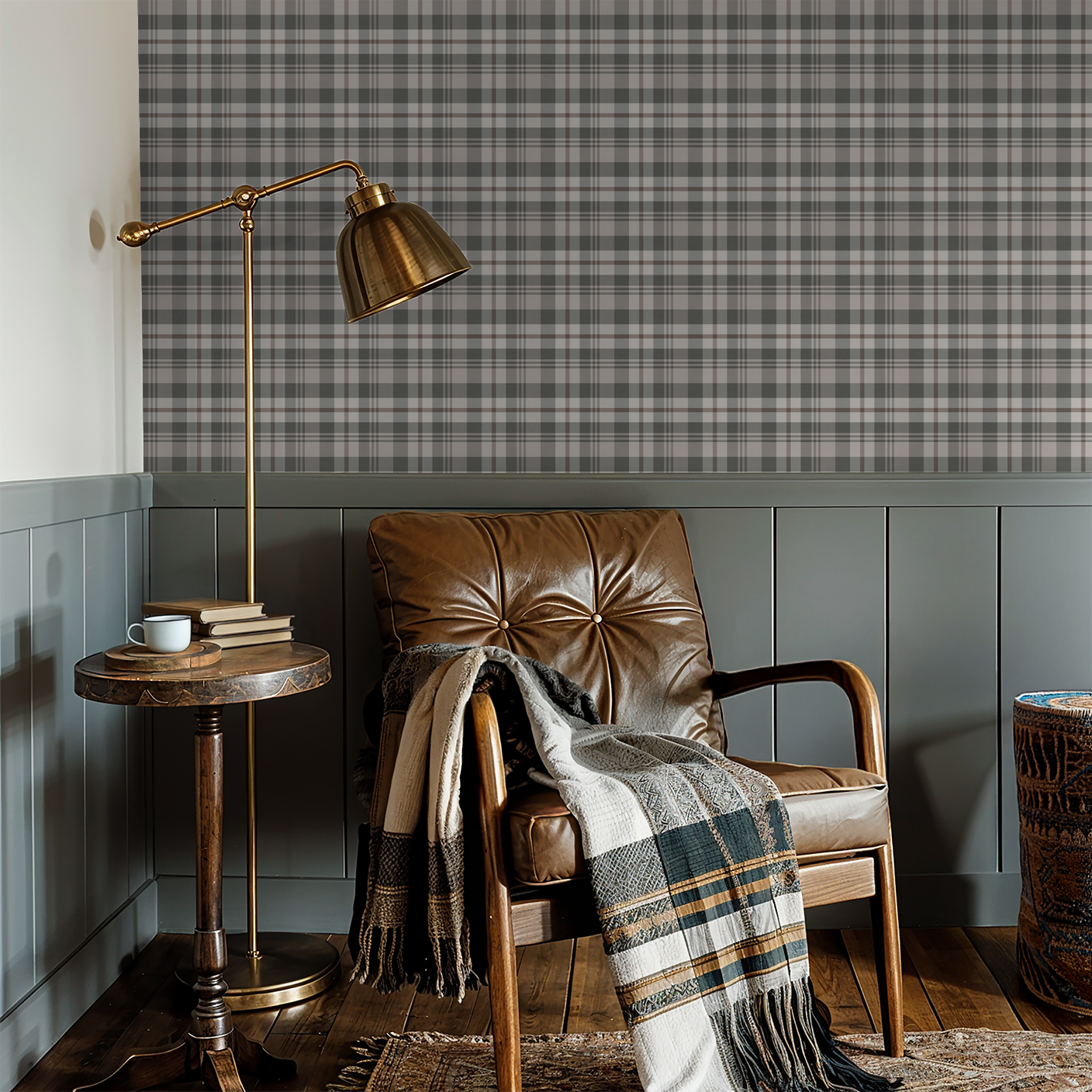 Plaid cream and green wallpaper in cozy reading nook with leather chair and lamp.
