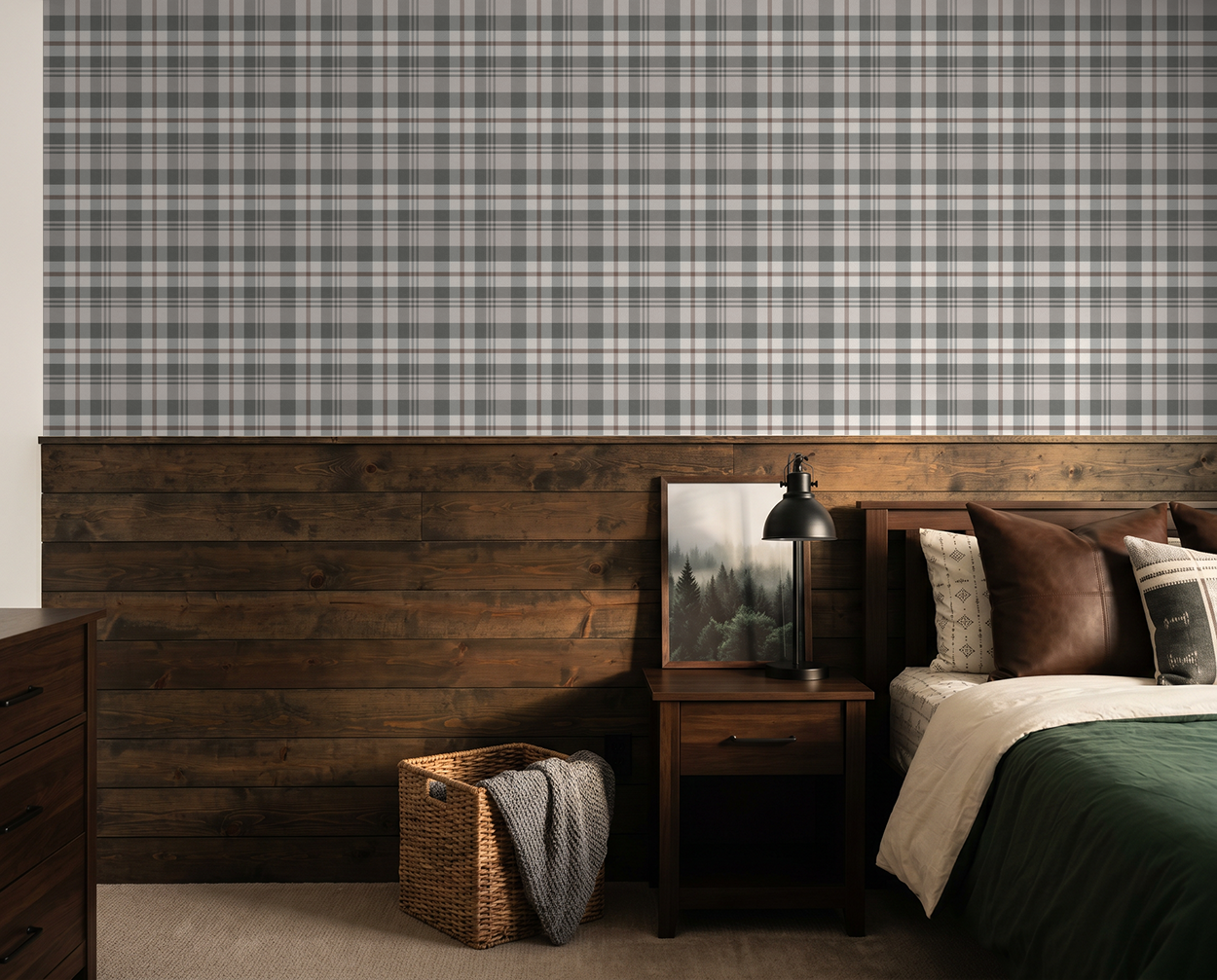 Plaid cream and green wallpaper in rustic bedroom setting with wood accents.