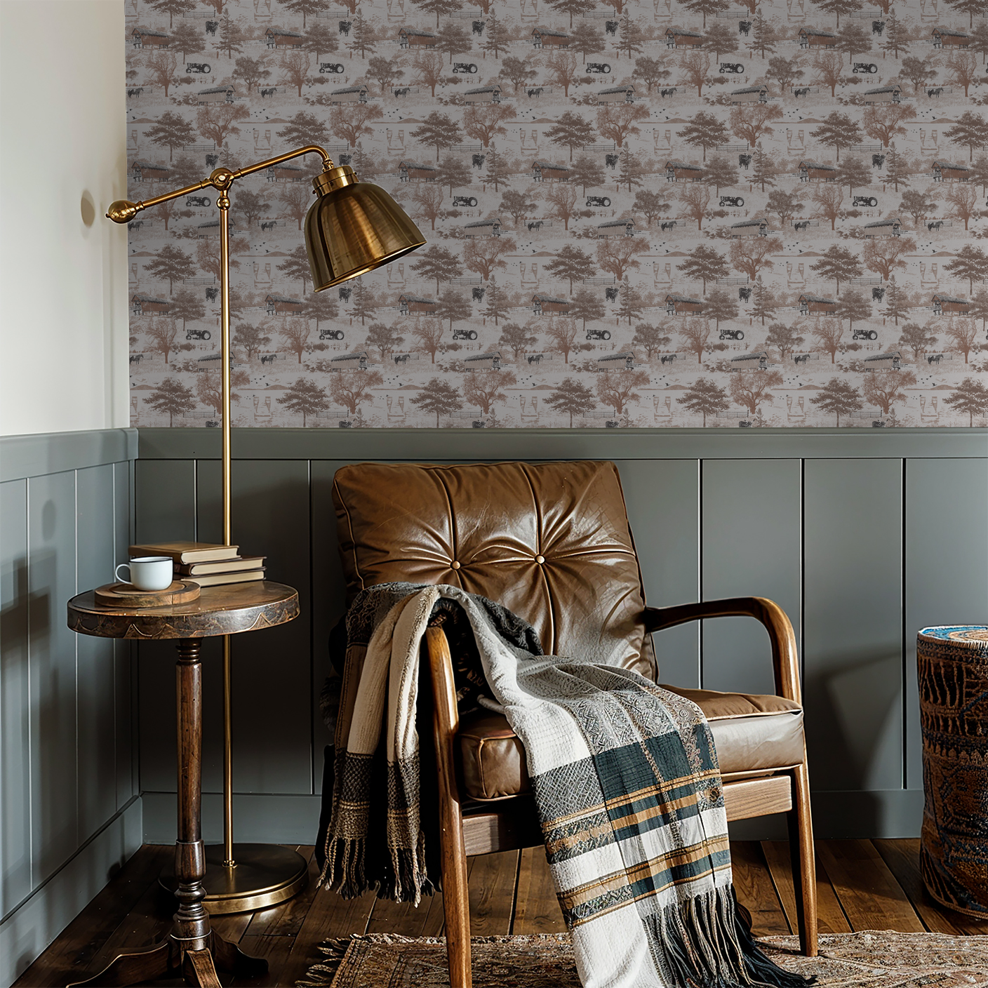 Rustic countryside toile wallpaper with barns and trees in a cozy study setting.