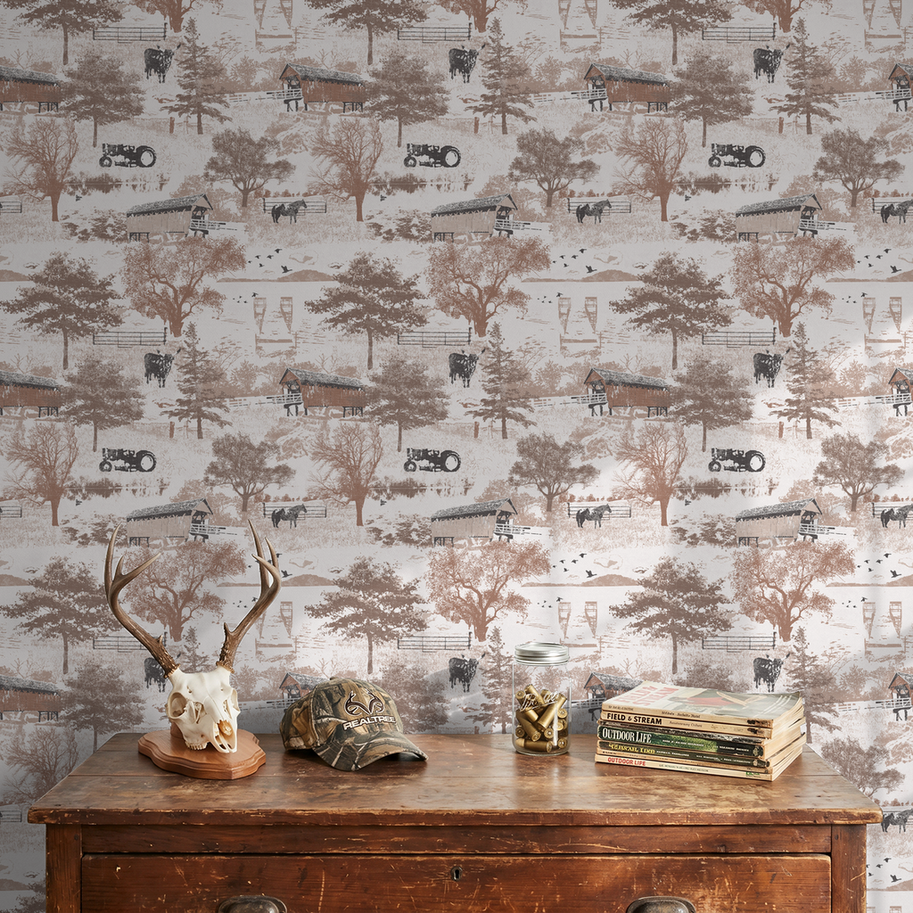 Rustic countryside toile wallpaper with barns, cattle, and trees in sepia tones.
