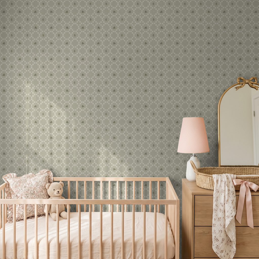 Sage botanical lattice wallpaper in nursery with crib and dresser.