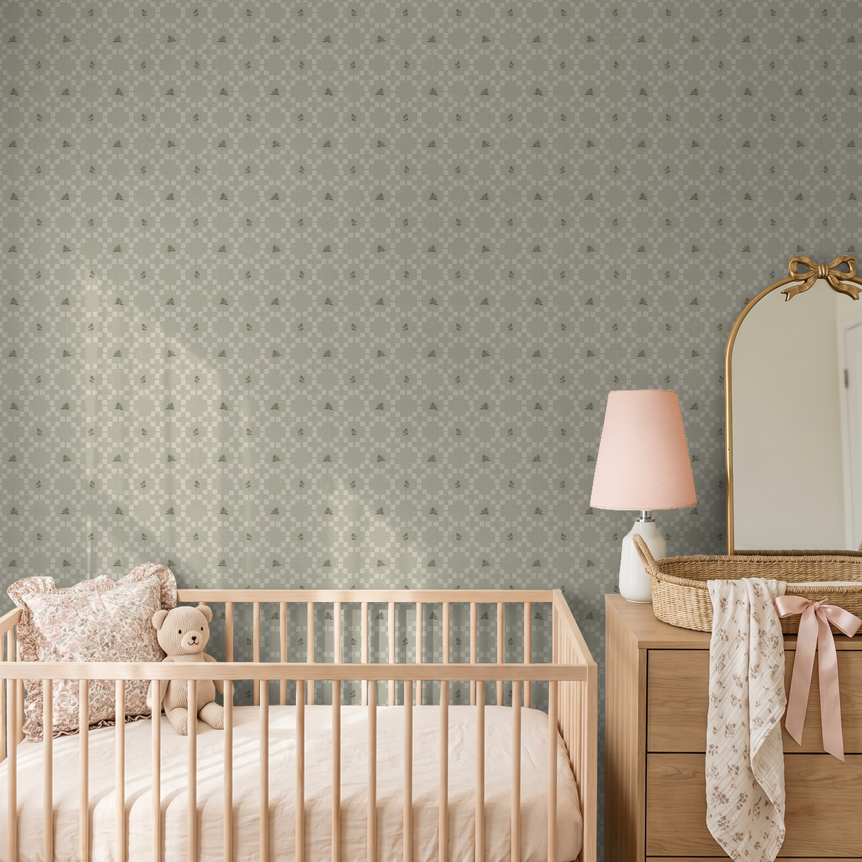 Sage botanical lattice wallpaper in nursery with crib and dresser.