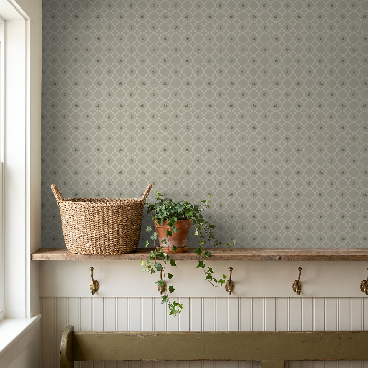 Sage botanical lattice wallpaper in rustic room with basket and plant