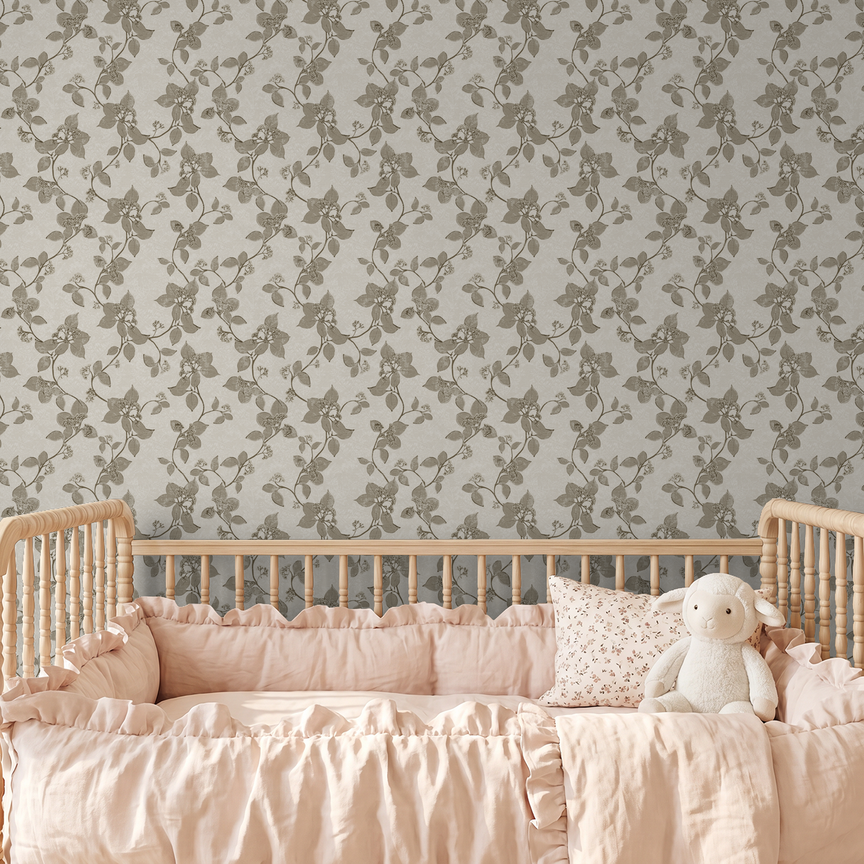 Sage floral vine wallpaper in nursery with wooden crib and pink bedding.