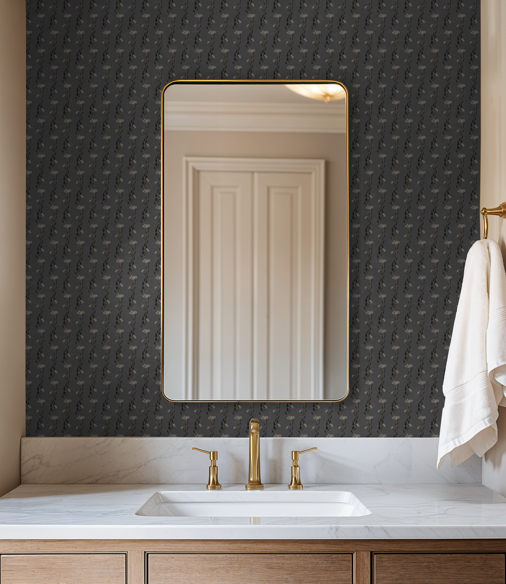 Slate floral vine wallpaper in elegant bathroom with mirror and gold fixtures.