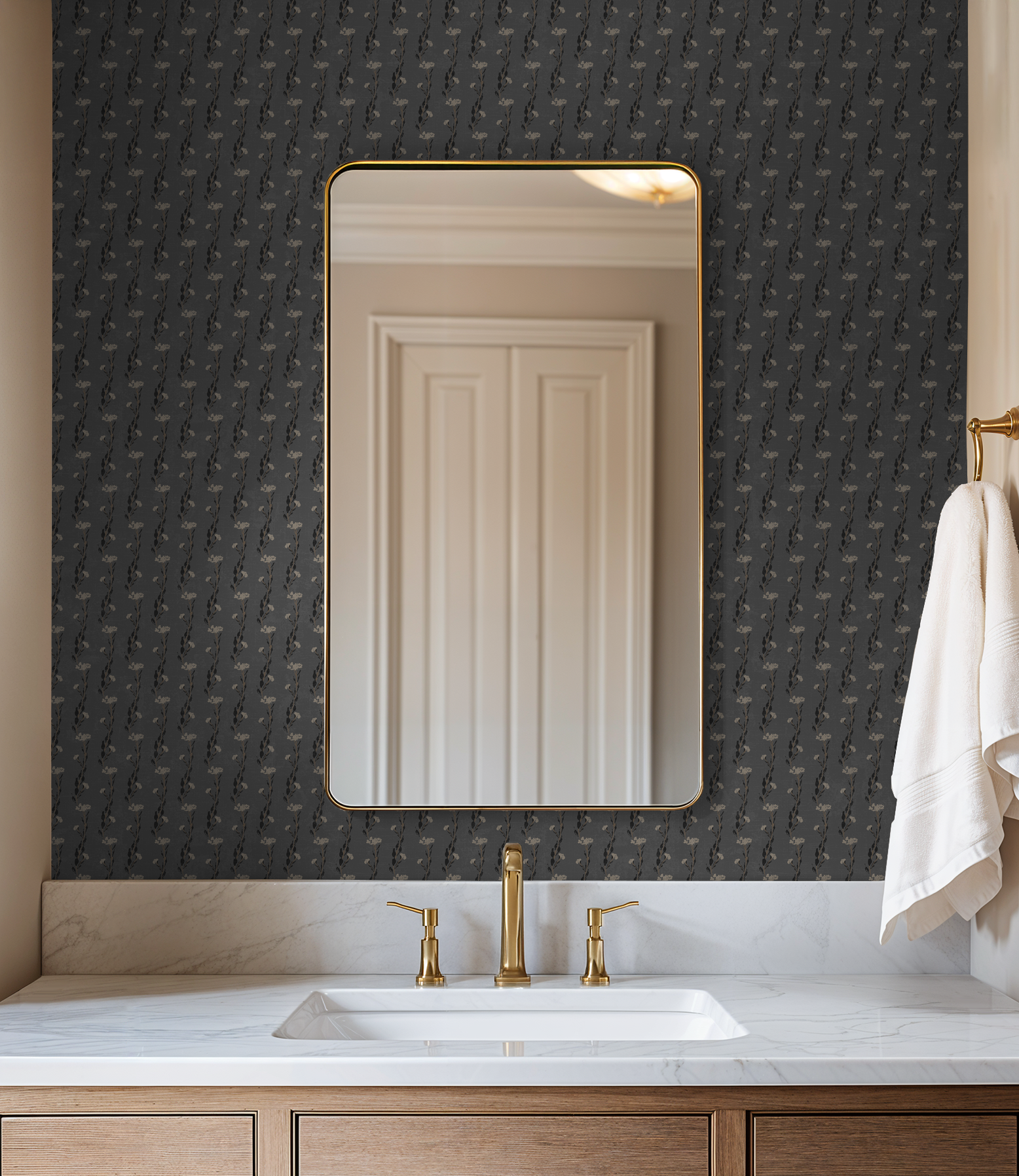 Slate floral vine wallpaper in elegant bathroom with mirror and gold fixtures.