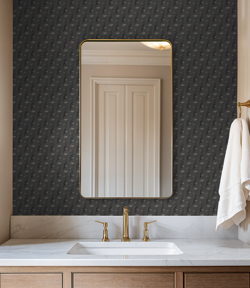Slate floral vine wallpaper in elegant bathroom with mirror and gold fixtures.