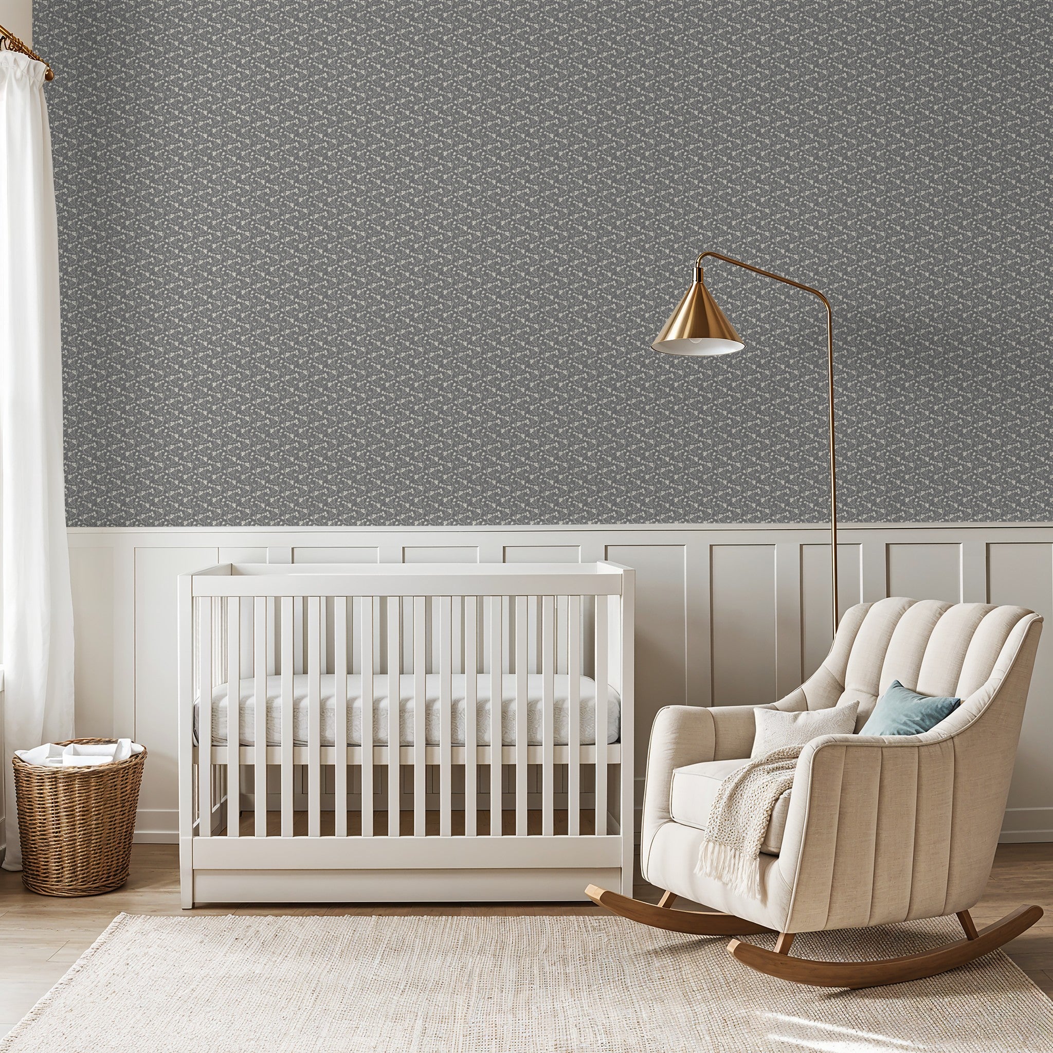Slate floral wallpaper in a serene nursery with white crib and beige rocking chair.