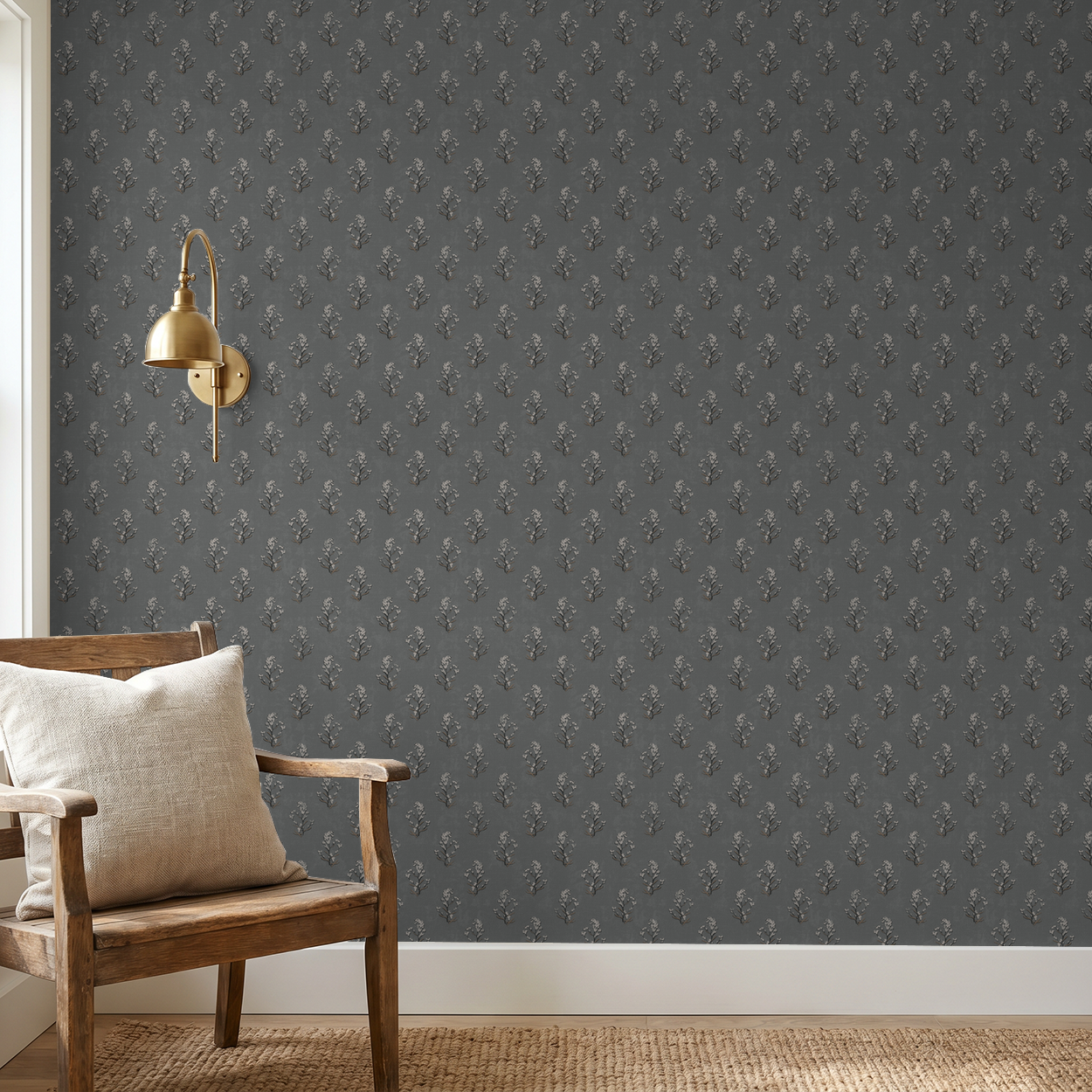 Slate floral wallpaper with white blossoms in a cozy room with wooden chair and lamp.