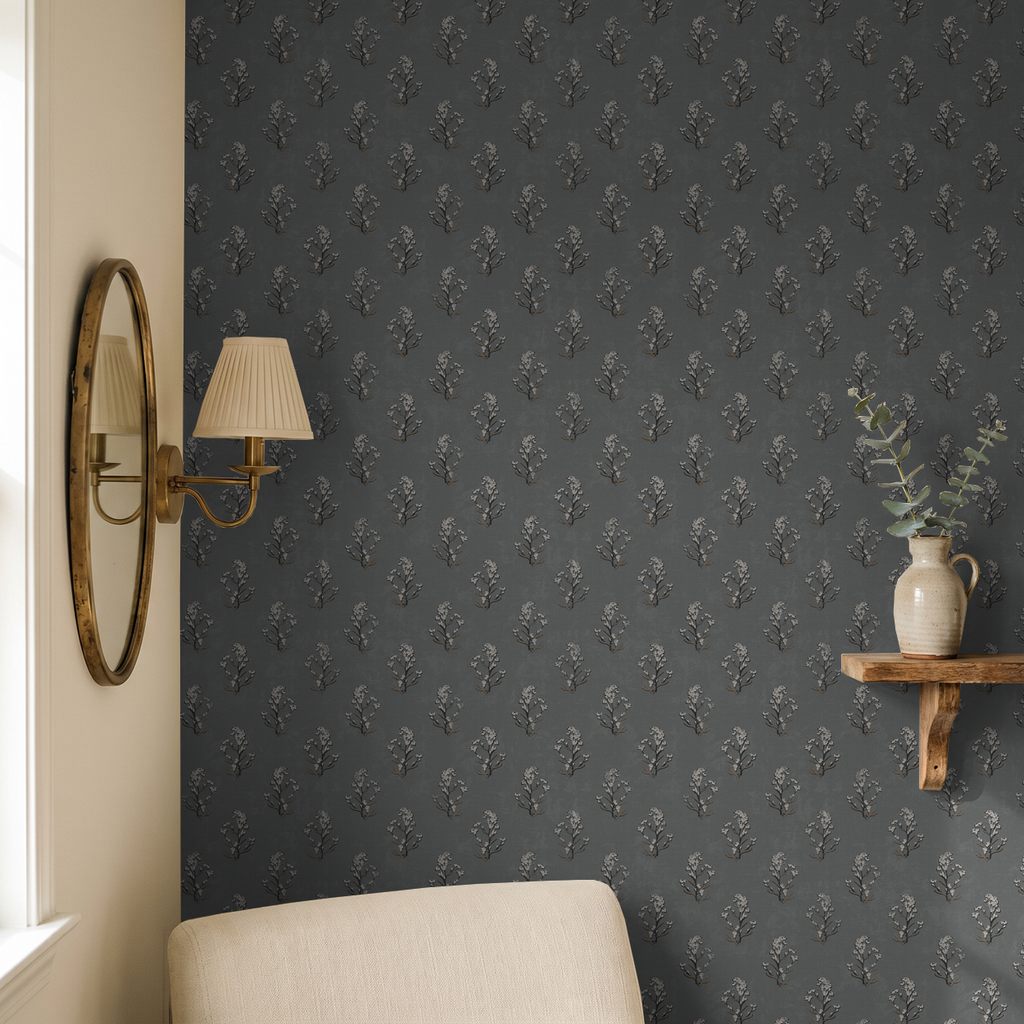 Slate floral wallpaper with white blossoms in cozy room setting.