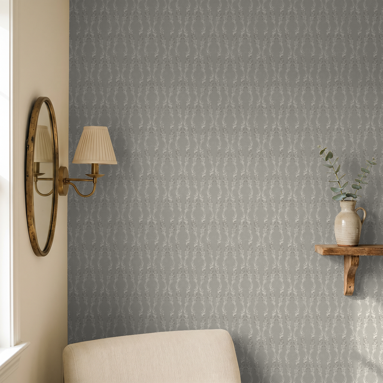 Stone floral garland wallpaper in elegant room with mirror and vase.