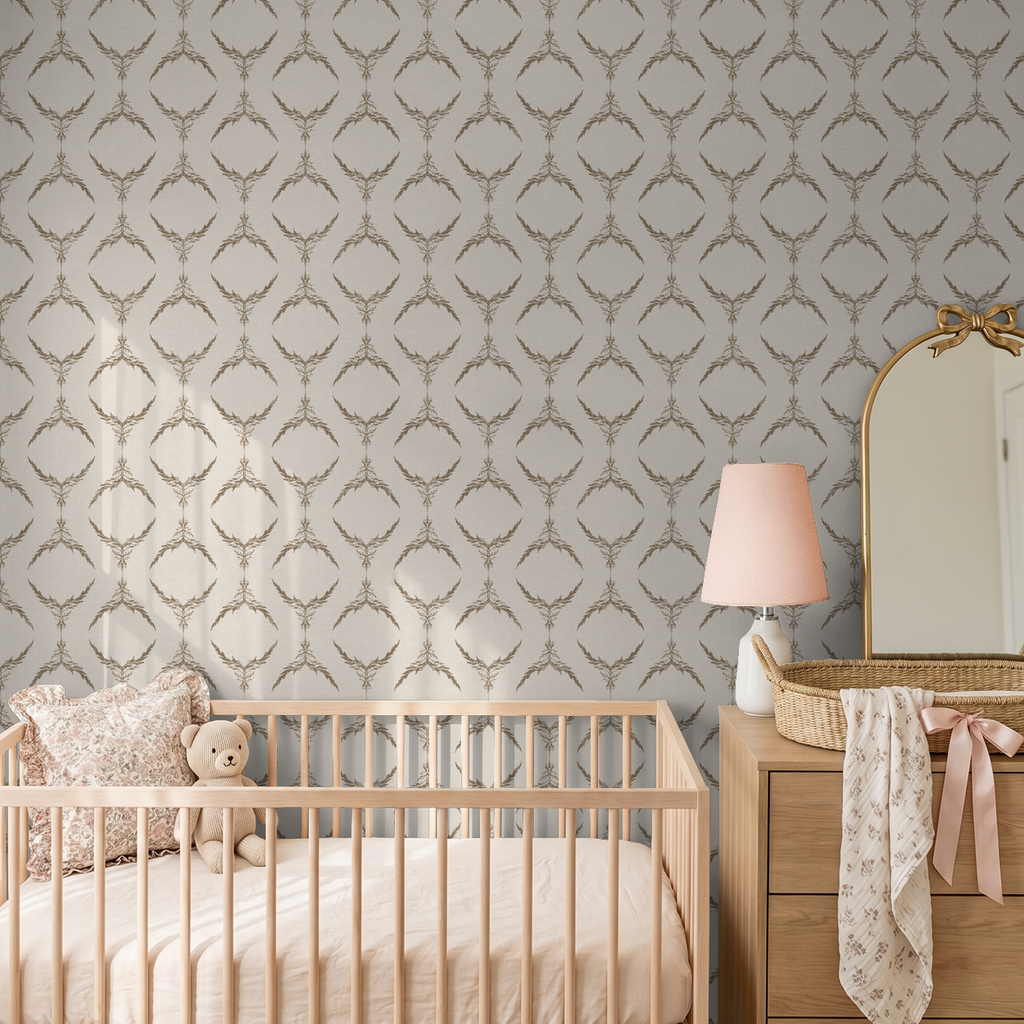 Taupe botanical medallion wallpaper in nursery with crib and dresser.