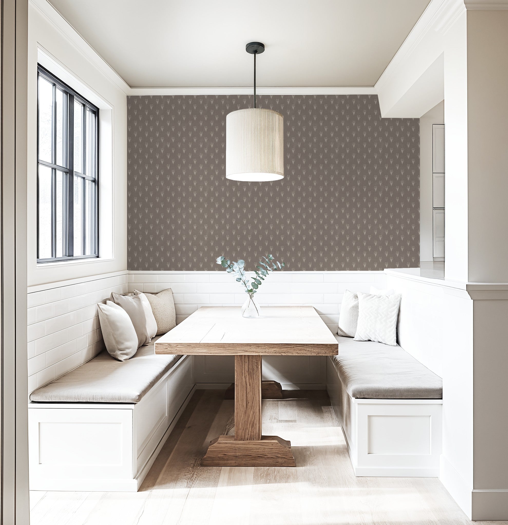 Taupe wallpaper with ivory botanical pattern in modern dining nook with wooden table.