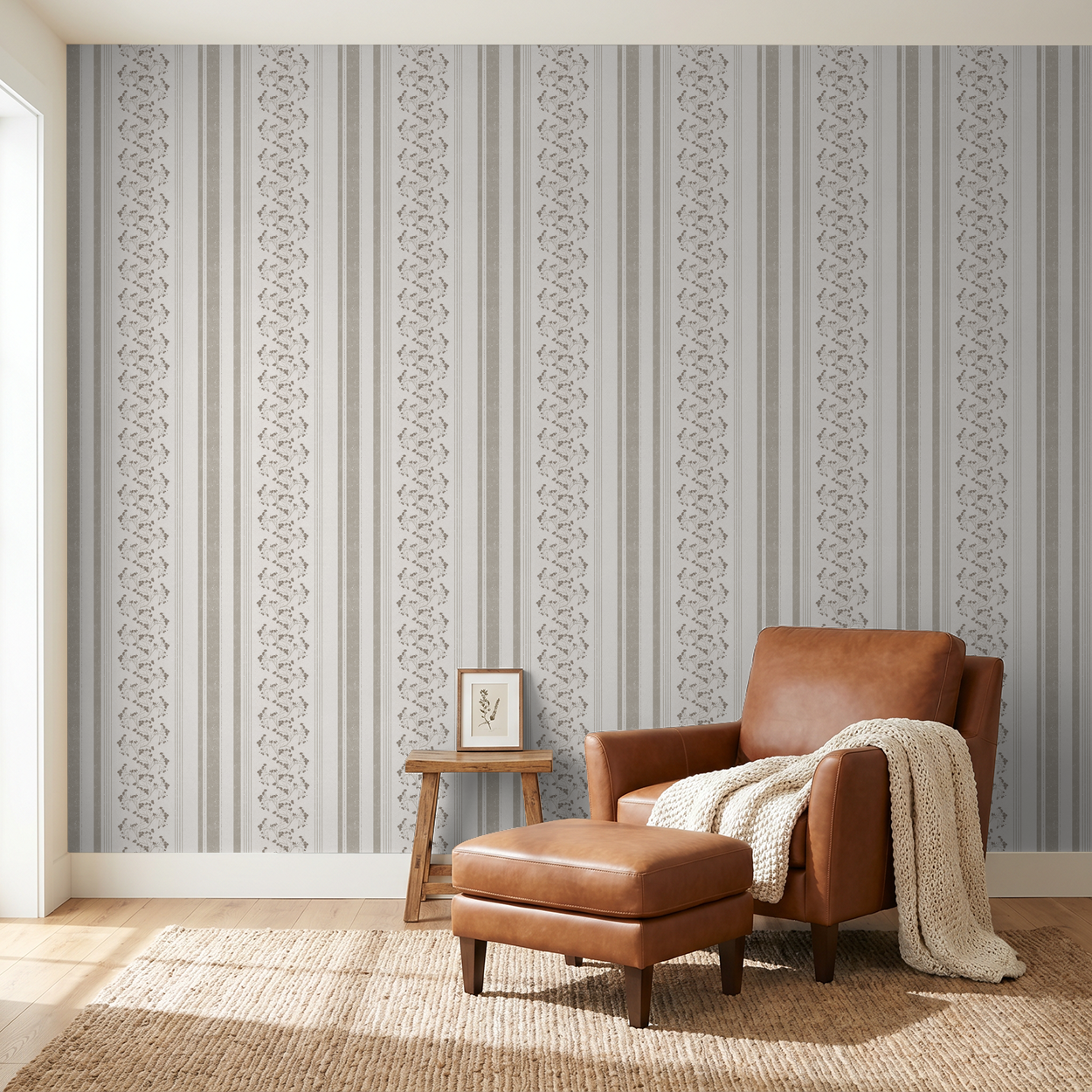 Taupe floral stripe wallpaper in cozy living room with leather chair.