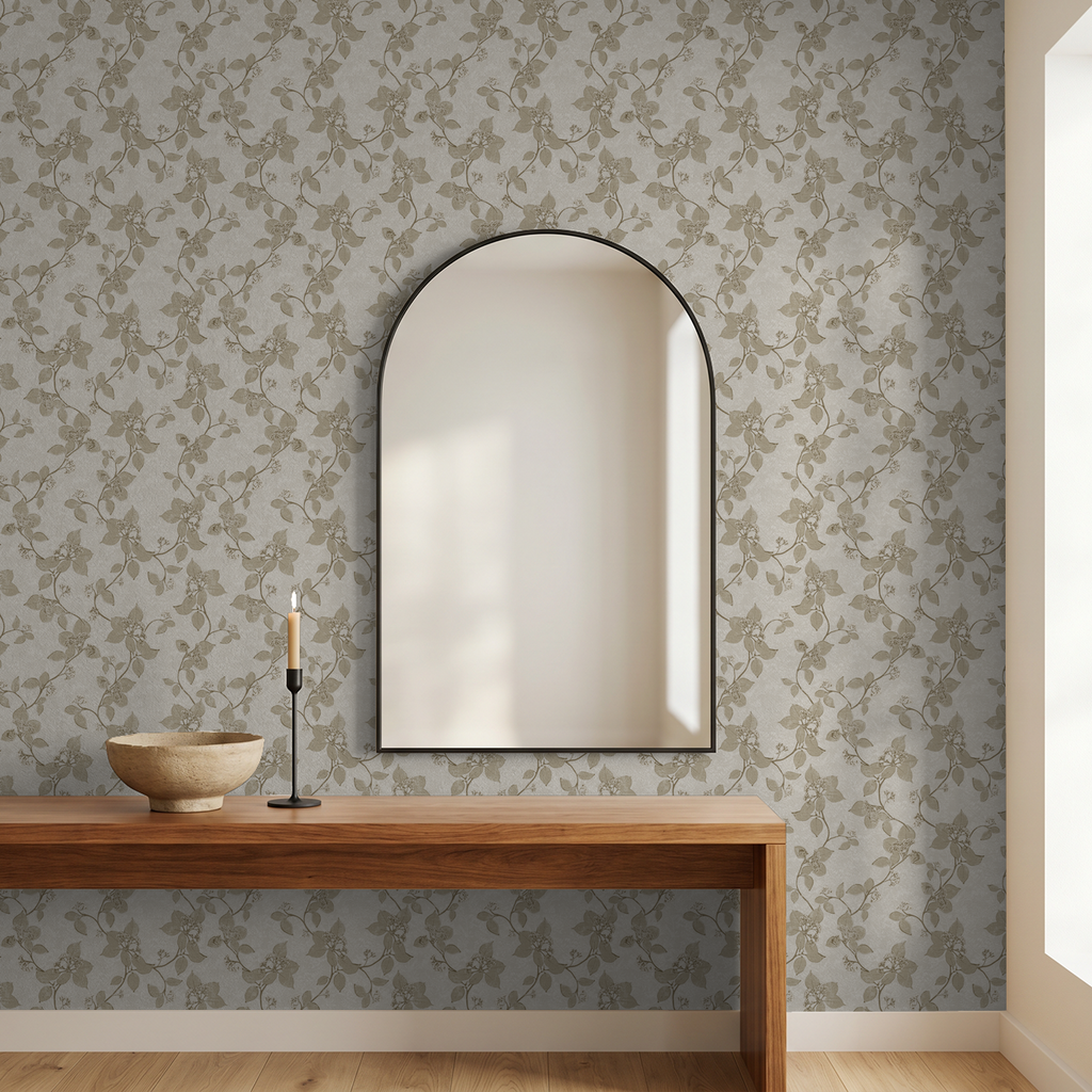 Taupe floral vine wallpaper in elegant room with mirror and wooden table.