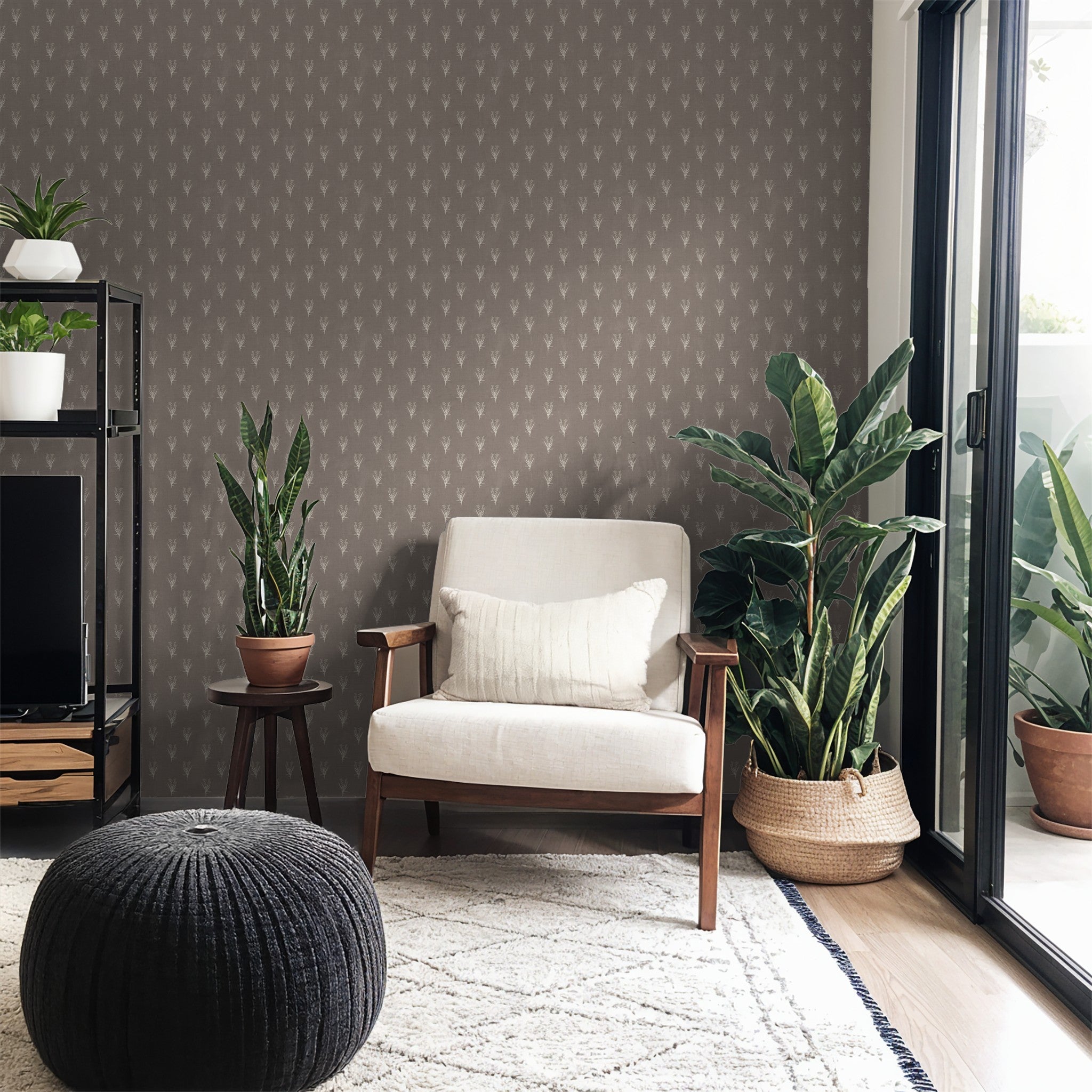 Taupe floral wallpaper in modern living room with plants and armchair.