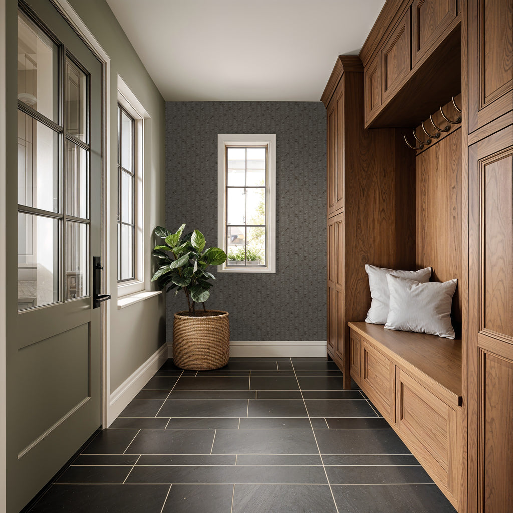 Taupe olive branch wallpaper in a rustic entryway with wooden cabinets and potted plant.