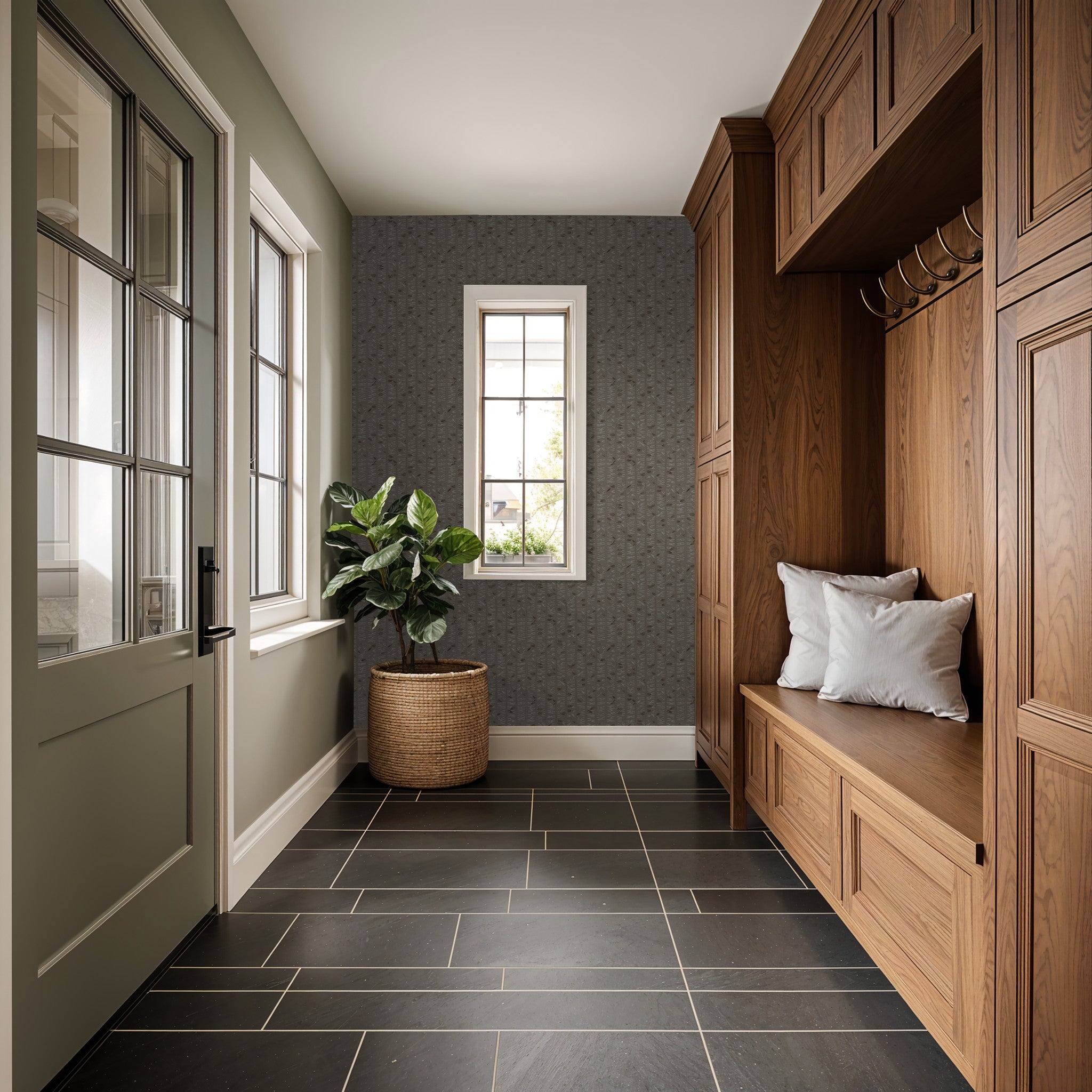 Taupe olive branch wallpaper in a rustic entryway with wooden cabinets and potted plant.
