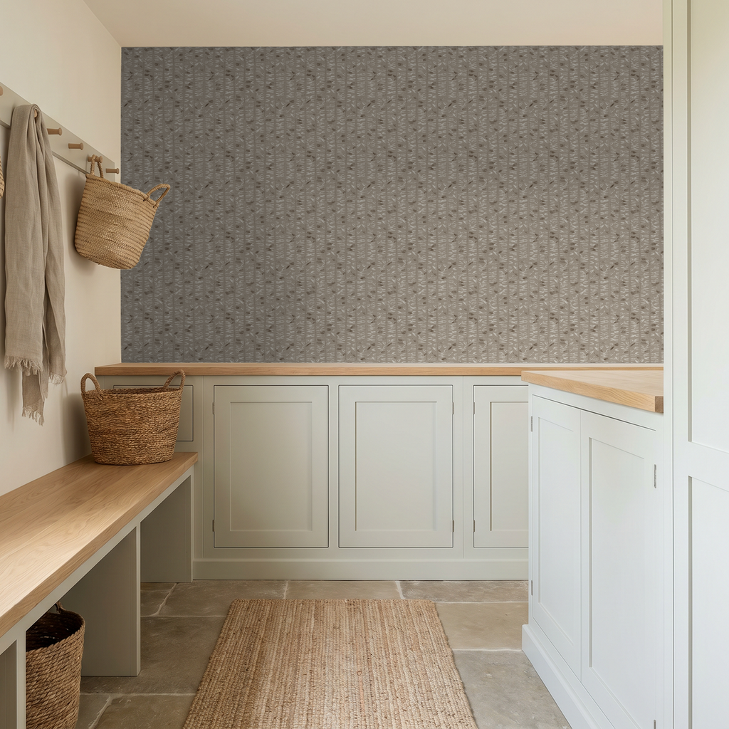 Taupe olive branch wallpaper in rustic entryway with baskets and bench.