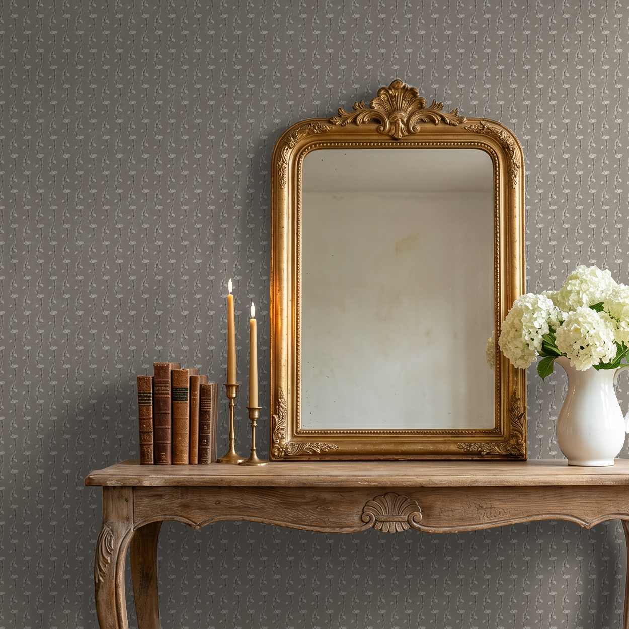 Taupe vine wallpaper in elegant room with ornate mirror and vintage decor.