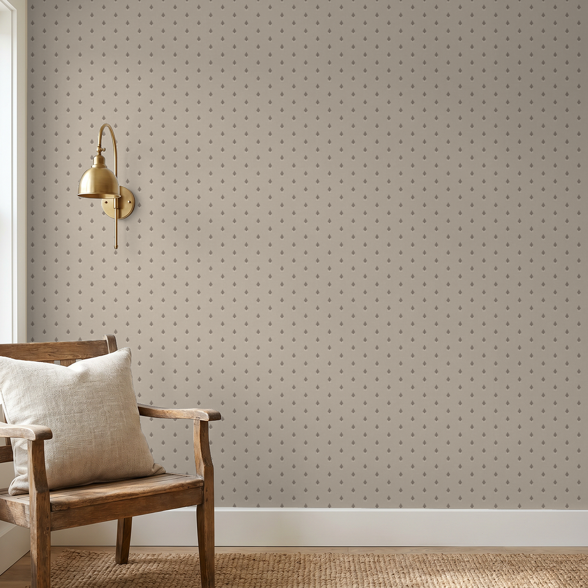 Vintage block print wallpaper in oatmeal with delicate motif in cozy room setting.