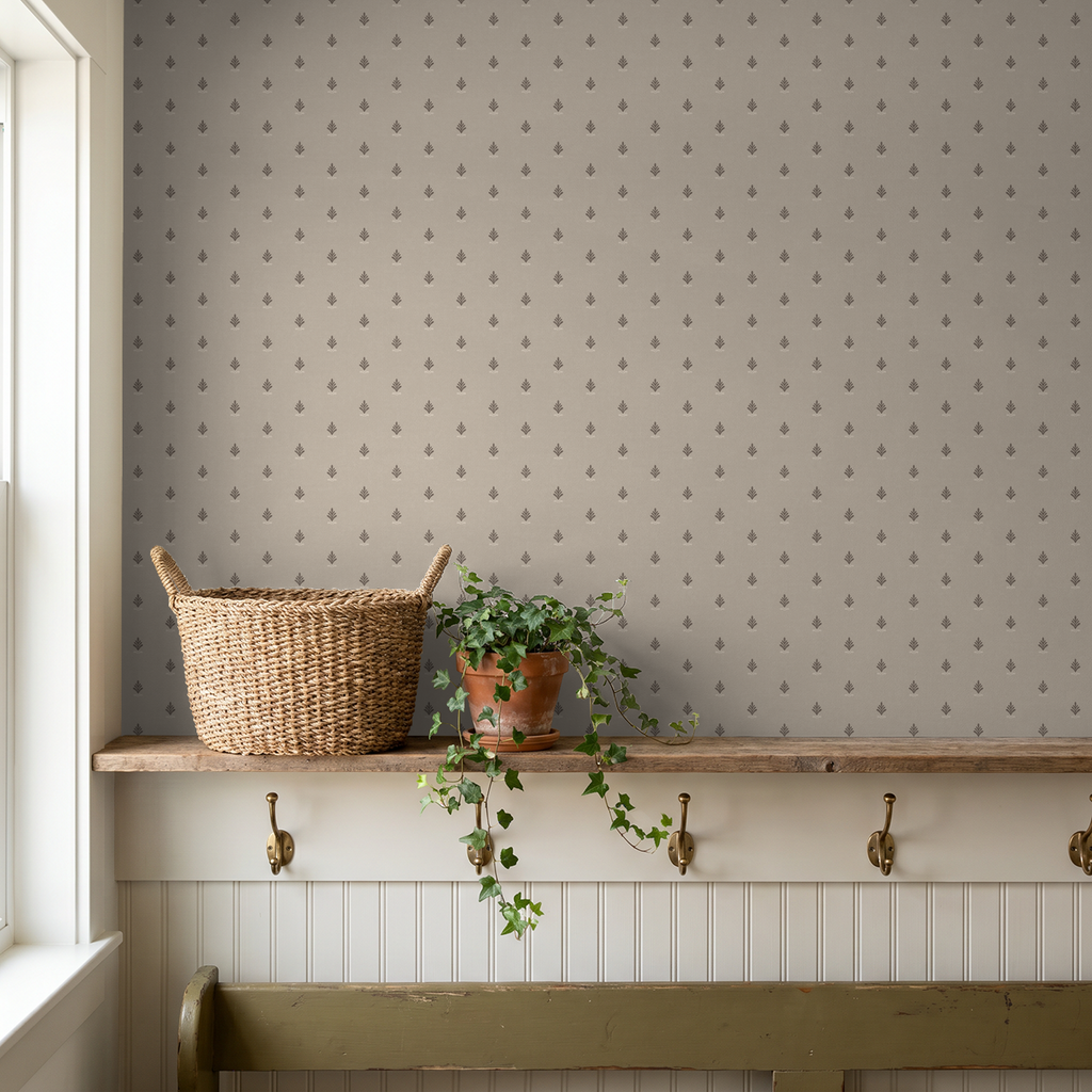 Vintage block print wallpaper with taupe backdrop in cozy room with basket and plant.
