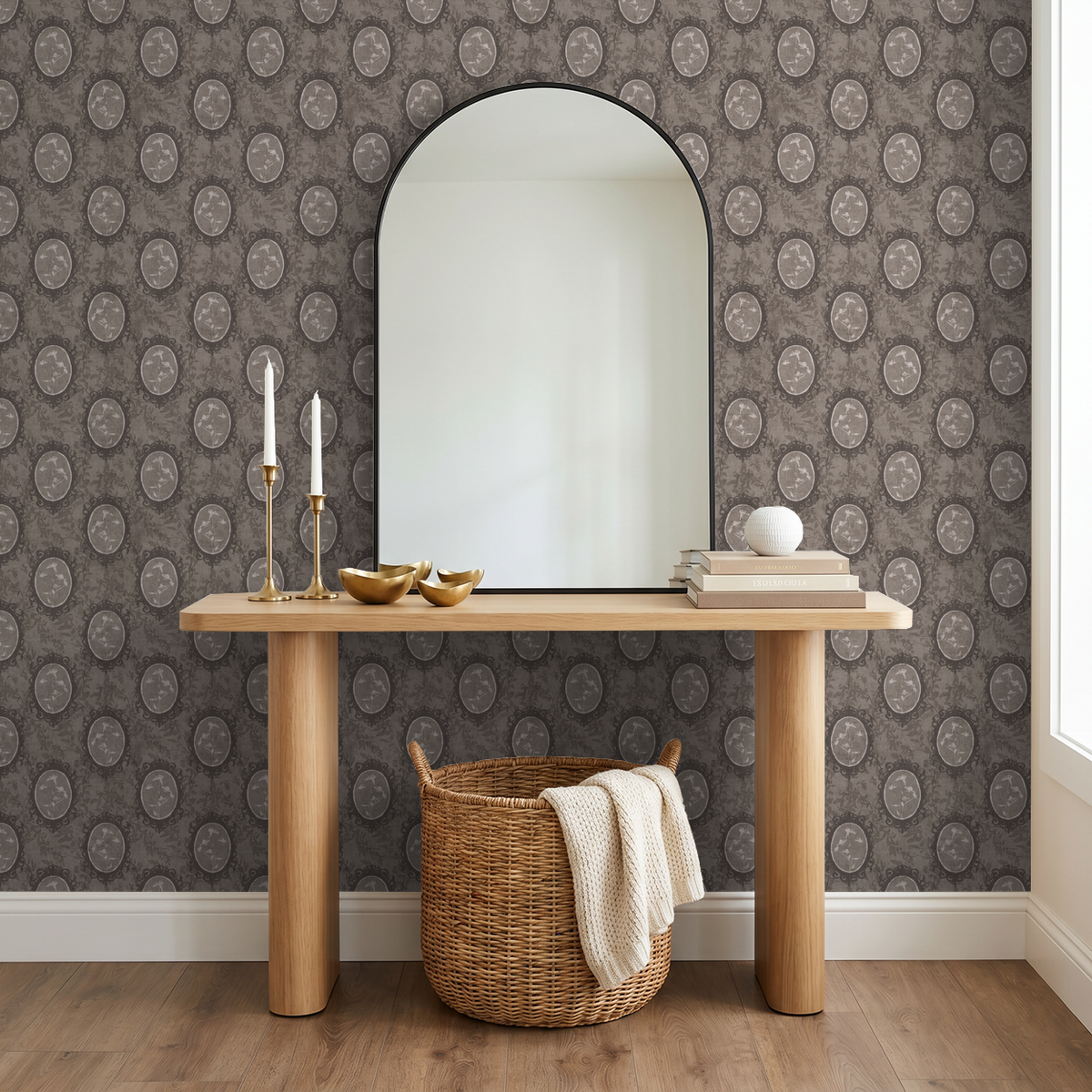 Vintage floral wallpaper with oval frames in a stylish entryway with mirror and decor.