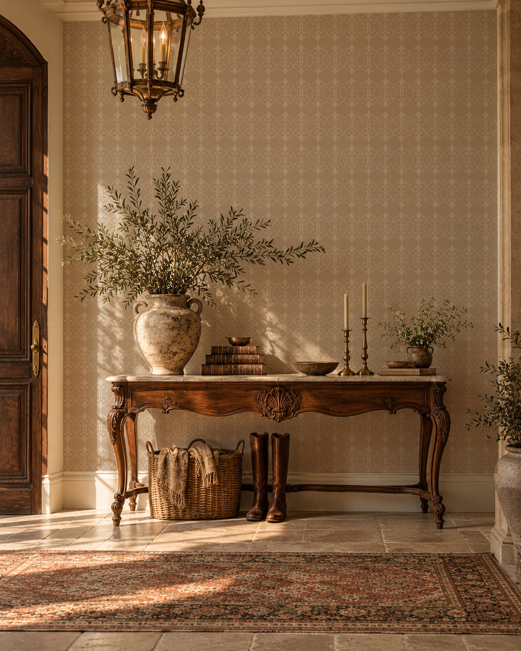 Vintage ornamental trellis wallpaper in warm taupe and ivory in elegant entryway with wooden furniture.