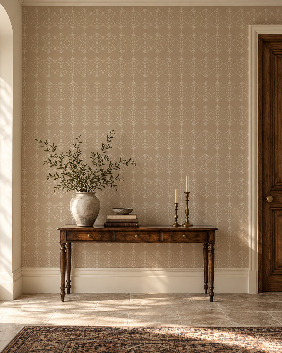 Vintage taupe and ivory trellis wallpaper in elegant entryway with wooden console.