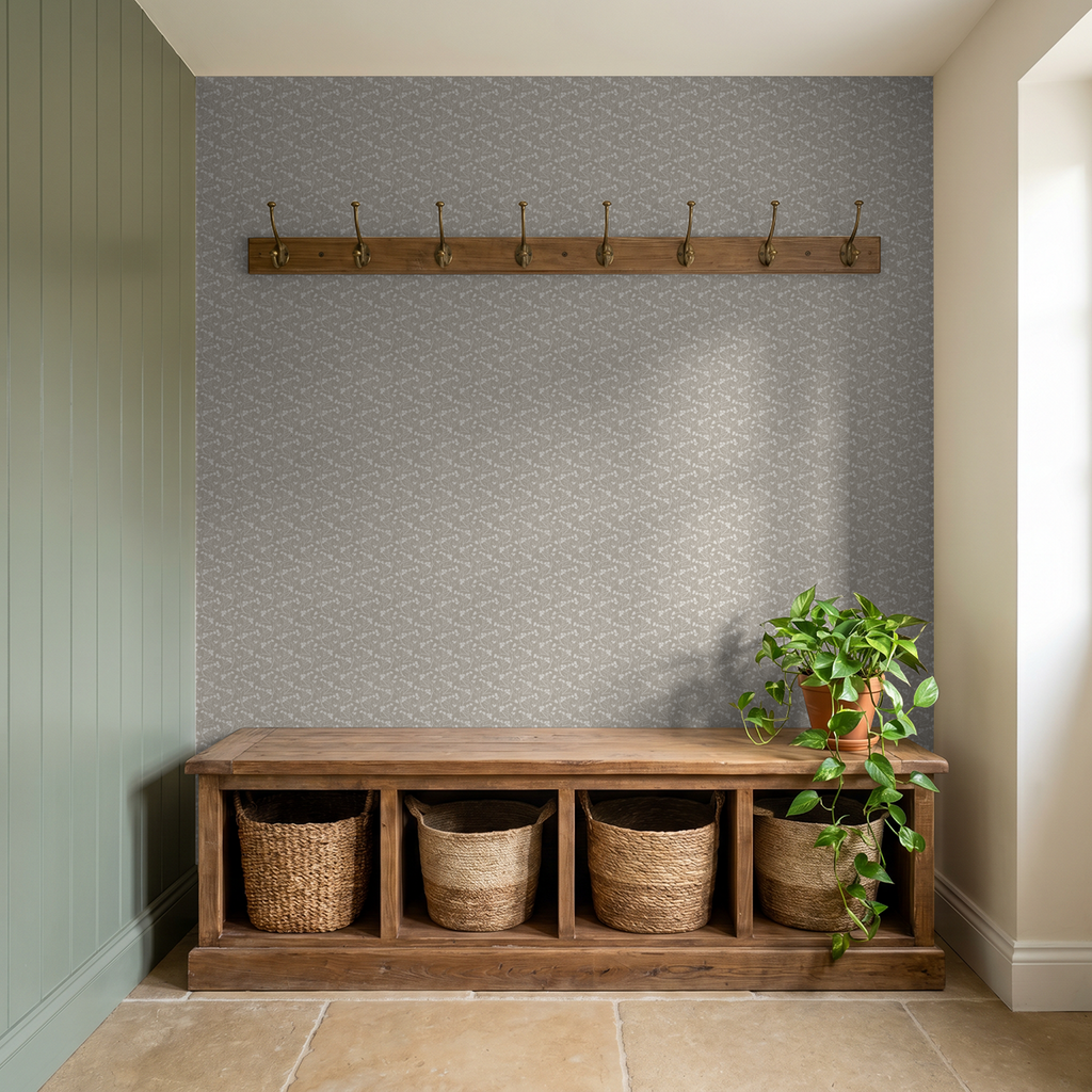 Wild meadow stone floral wallpaper in rustic entryway with wooden bench and plant.