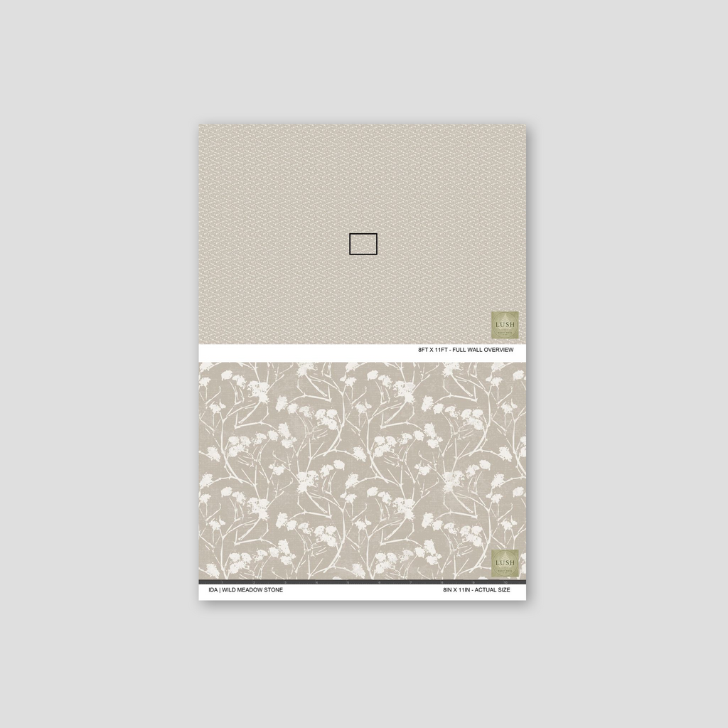 Wild meadow stone floral wallpaper sample with delicate white silhouettes on a soft stone background.