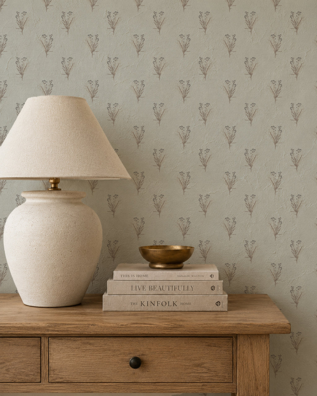 Wildflower bouquet wallpaper with botanical motifs in a rustic room setting.