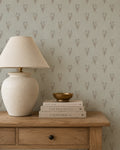Wildflower bouquet wallpaper with botanical motifs in a rustic room setting.