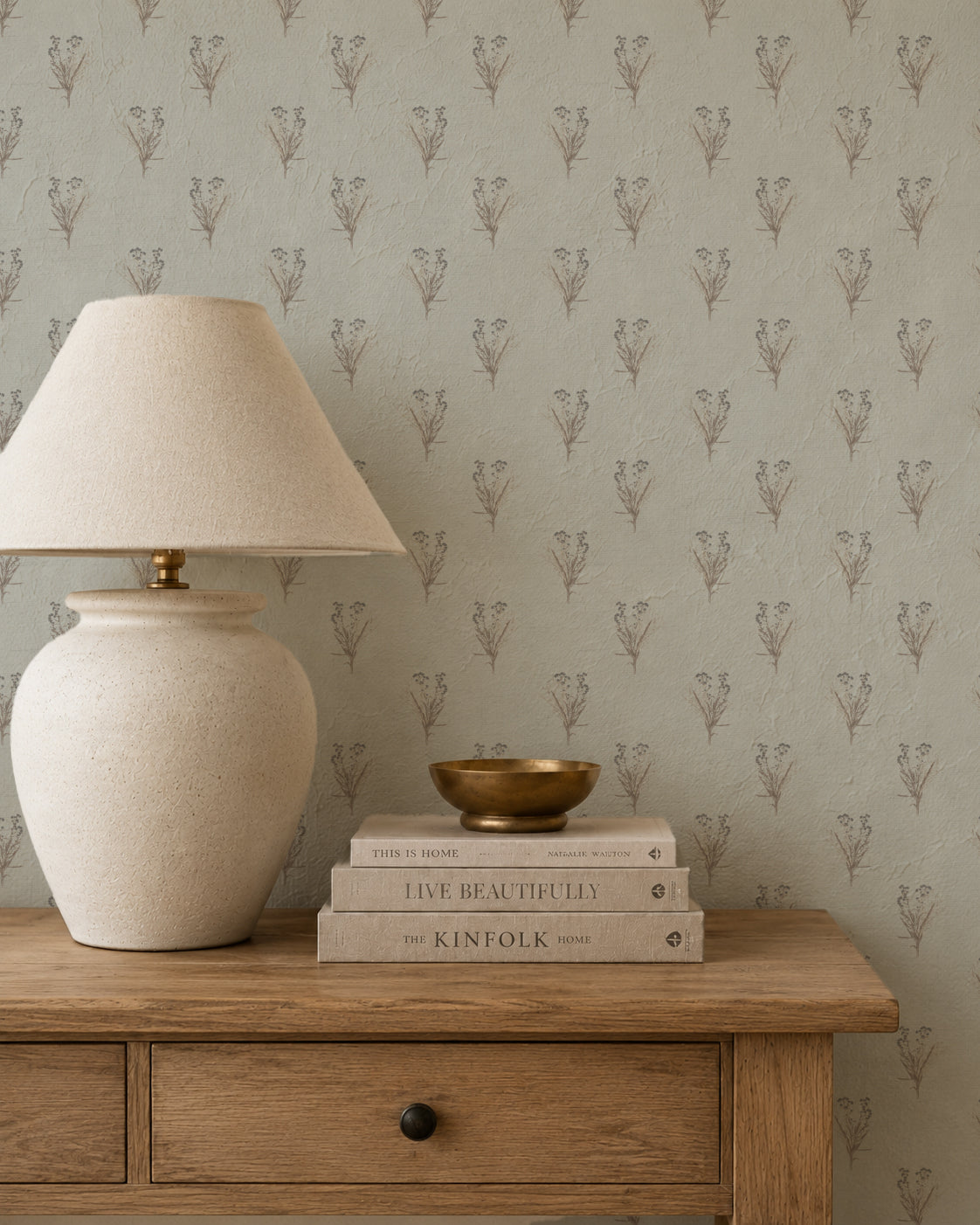 Wildflower bouquet wallpaper with botanical motifs in a rustic room setting.